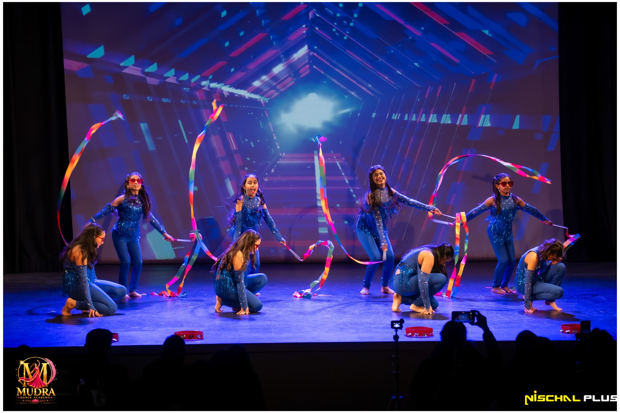 Mudra Dance Academy dancers performing in blue and silver costumes