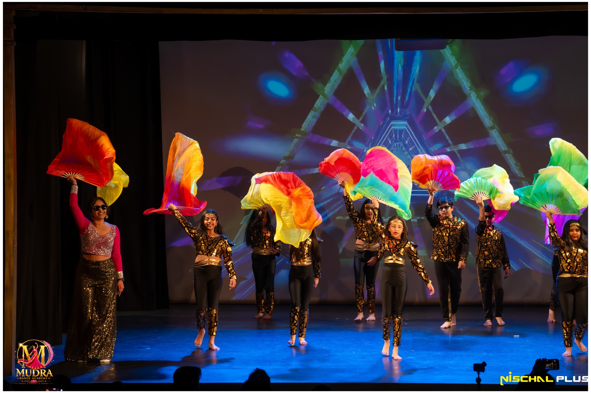 Mudra Dance Academy dancers performing with colourful umbrellas