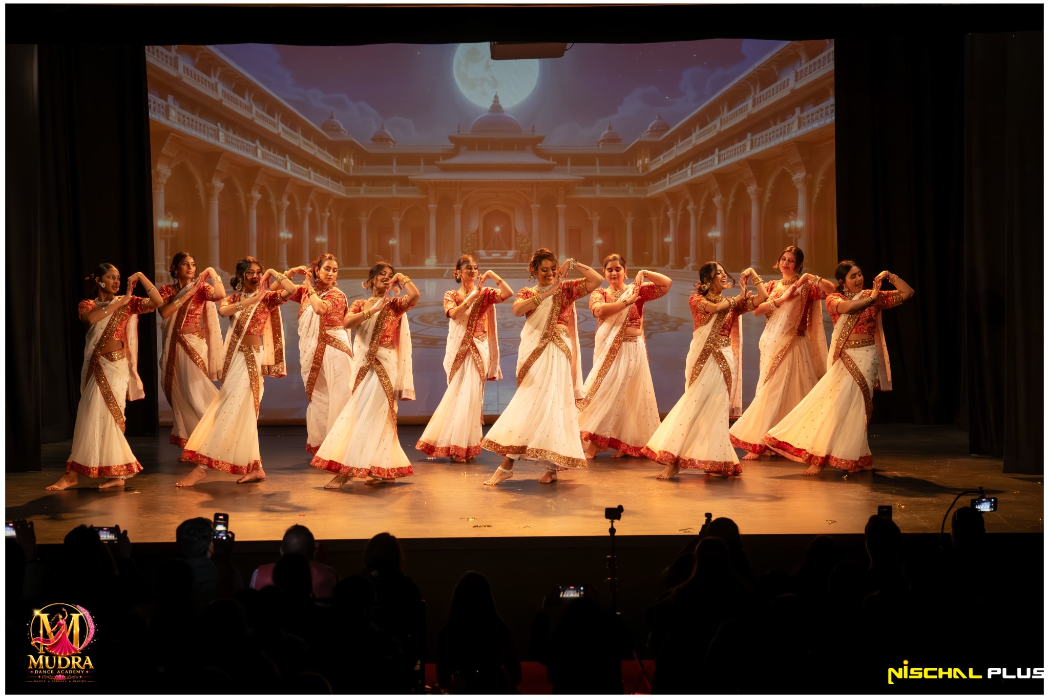 Wide stage view of the Mudra Dance Academy classical dance group